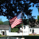 American flag and service outbuildings