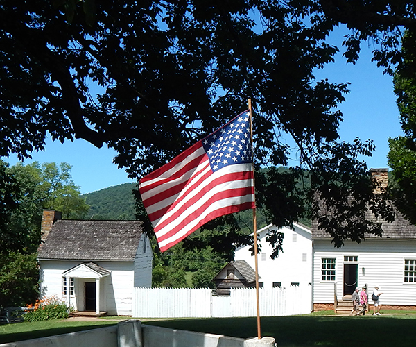 American Flag and Highland outbuildings