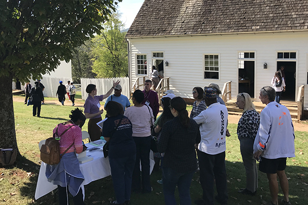 Guests learning about enslaved workers